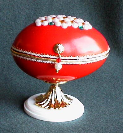 Red box with pearl daisies on top